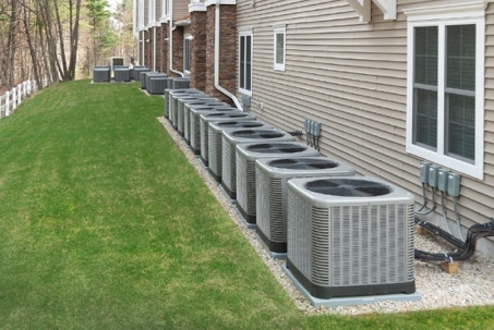 A row of identical air conditioning units