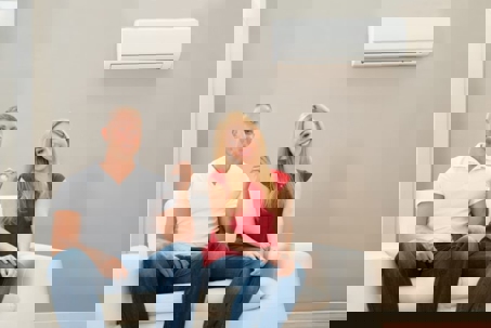 Man & woman sitting in the sofa