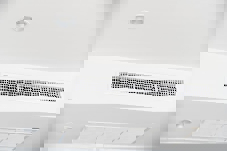 A ceiling HVAC system has an air vent