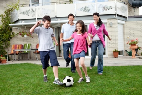 A family enjoys outdoor time in this eye-level shot.