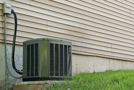 modern air conditioning unit sitting outside a home